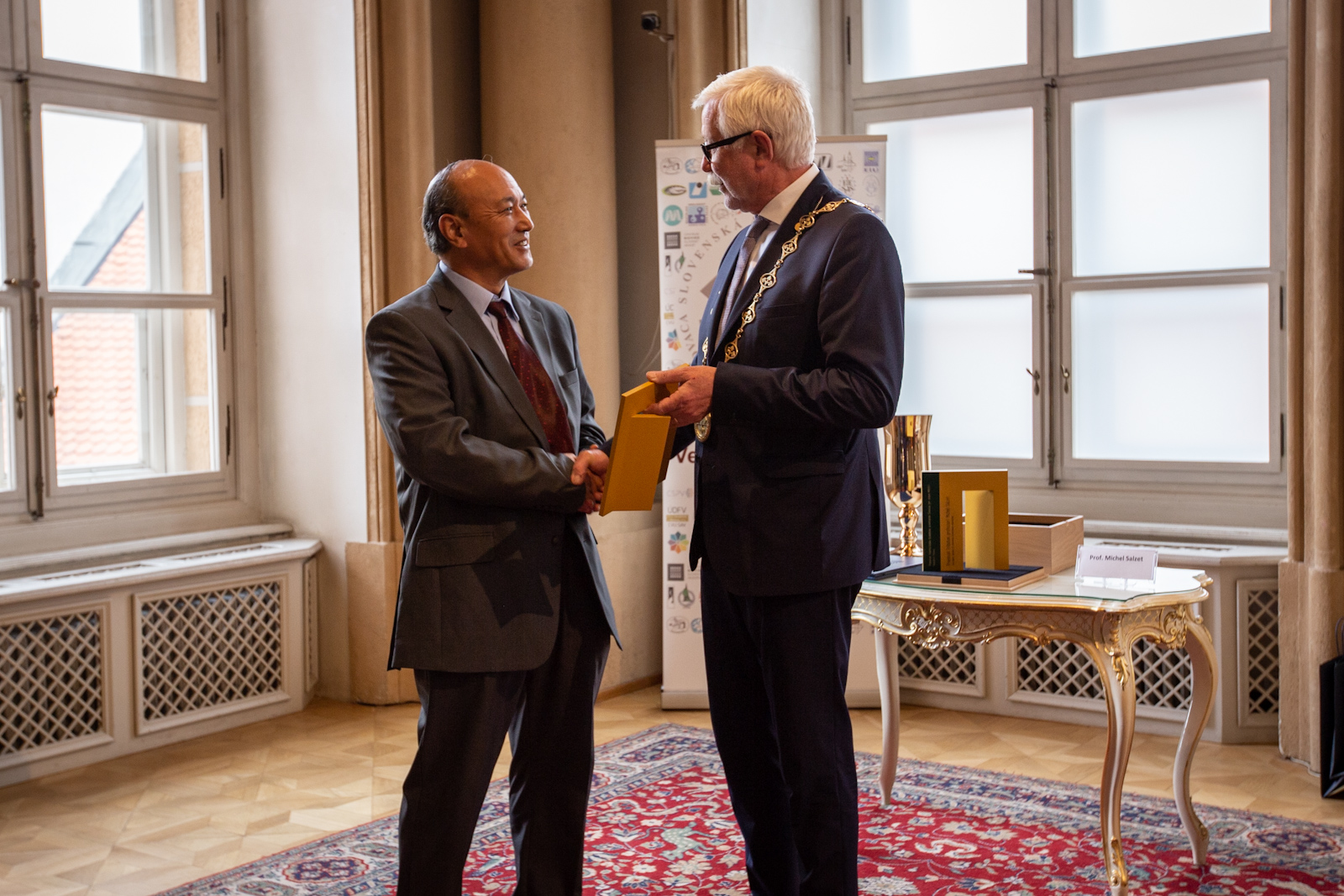 Prof. YangQuan Chen accepts the SAV International Prize from the SAV President Prof. Pavol Šajgalík